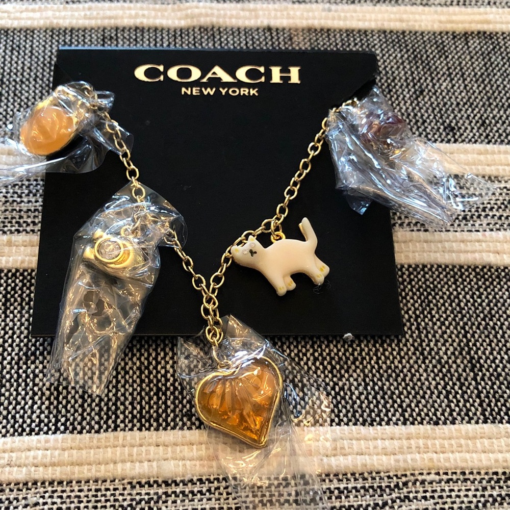 Authentic New on card Coach Gold-Tone Charm bracelet with Charms